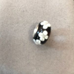Sterling silver black charm with white flowers